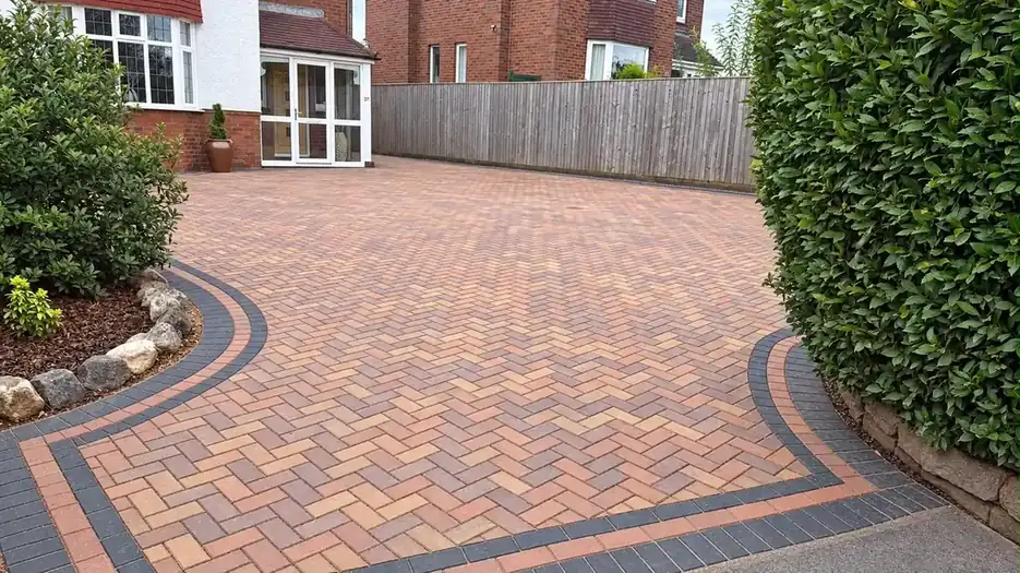 Multitone block-paved driveway with sweeping charcoal edging